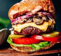A burger is a classic fast food item, typically consisting of a juicy beef patty, served in a soft bun with toppings like lettuce, tomato, cheese, and condiments. It’s customizable, satisfying, and popular globally in various styles.