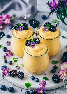 Vegan dessert options include dairy-free treats like coconut milk ice cream, avocado chocolate mousse, fruit sorbets, vegan brownies, and almond flour cookies, all made without animal products but still delicious.